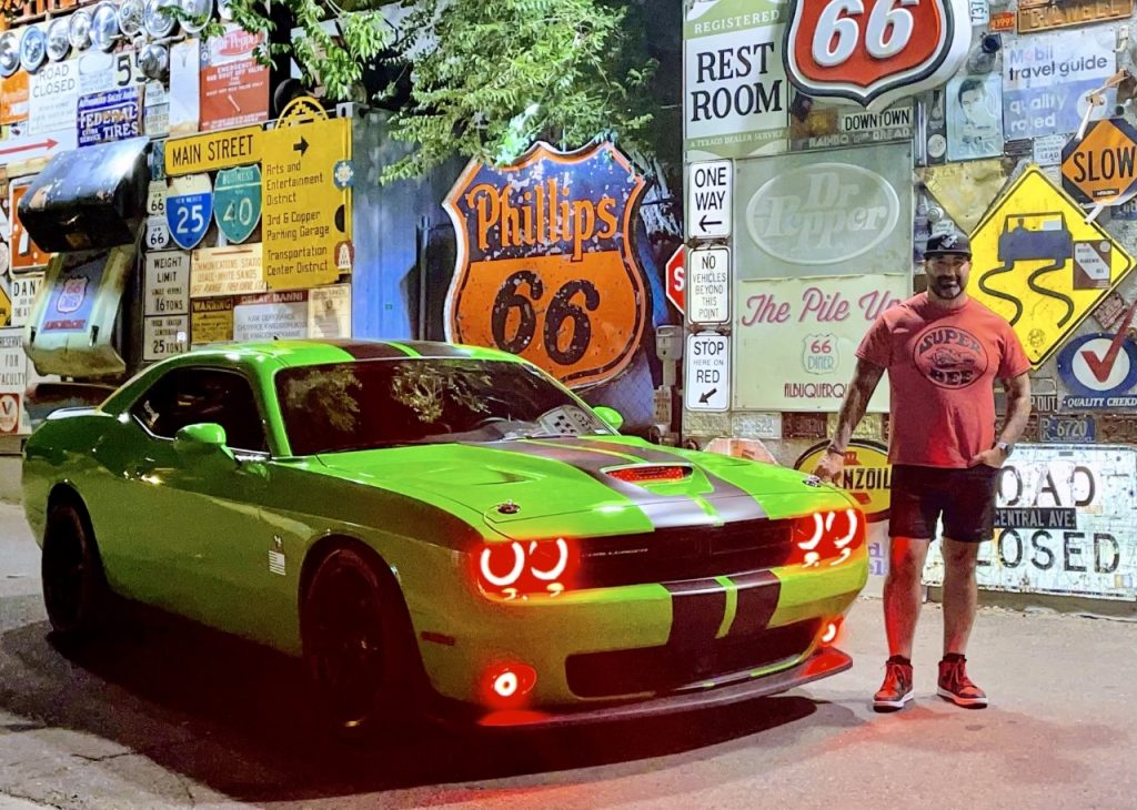 Nathan Sanchez of the Storehouse with his green muscle car