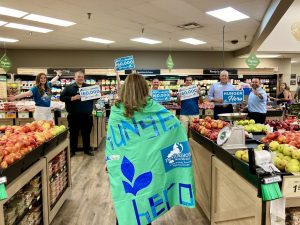 yvonne-hunger-hero-wears-cape-near-storehouse-and-albertsons-staff