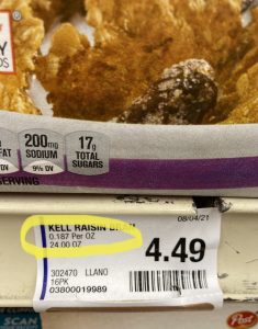 price per ounce sticker at the grocery store