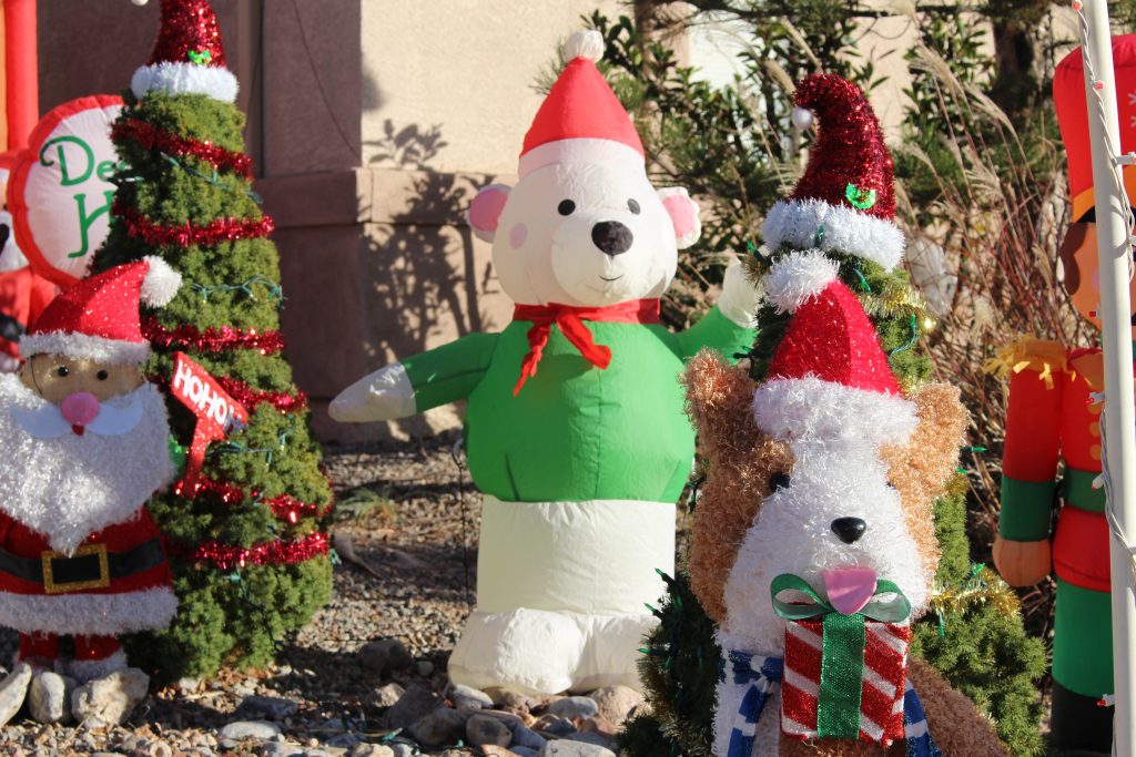 Inflatable Christmas animals in the front yard.