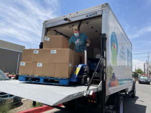 Storehouse truck delivering boxes of food for the homeless