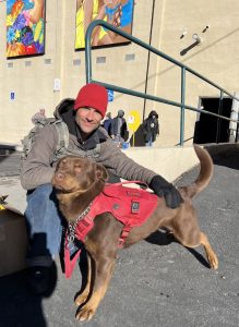 man and his dog at the Storehouse New Mexico food pantry for the monthly Pet Food Pantry